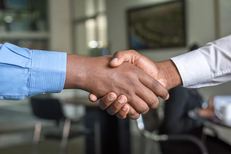 A professional handshake — the moment every lead begins